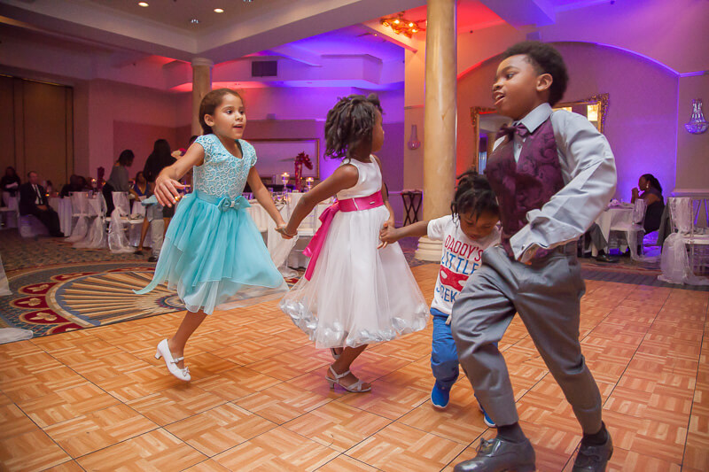 Photo of kids dancing at wedding reception at The Plaza Resort & Spa